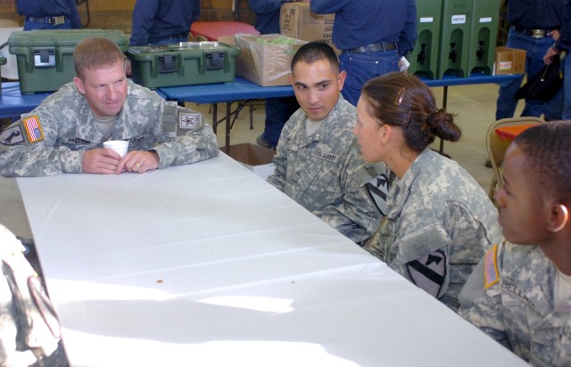 During his visit to Fort Hood, Texas, Sgt. Maj. of the Army Kenneth O. Preston (left) listens intently to the concerns of Forney, Texas native Pfc. Amanda Jenkins (second from right), a combat medic for Battery A, 2nd Battalion, 82nd Field Artillery ...