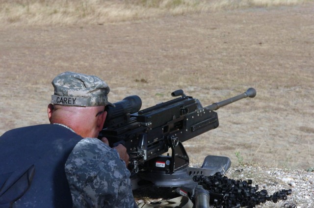 Command Sgt. Maj. Dennis Carey, command sergeant major for United States Armed Forces Command, tested out the newly designed Lightweight .50 Caliber Machine Gun July 29. Carey and several others from FORSCOM took a look at new weapons designed by Pro...