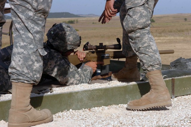 Tyler, Texas native, Spc. Todd Cushatt, artillery mechanic with Headquarters and Headquarters Battery, 1st Battalion, 82nd Field Artillery Regiment takes aim with the new M107 Semi-automatic Long Range Sniper Rifle July 29. The weapons and their syst...