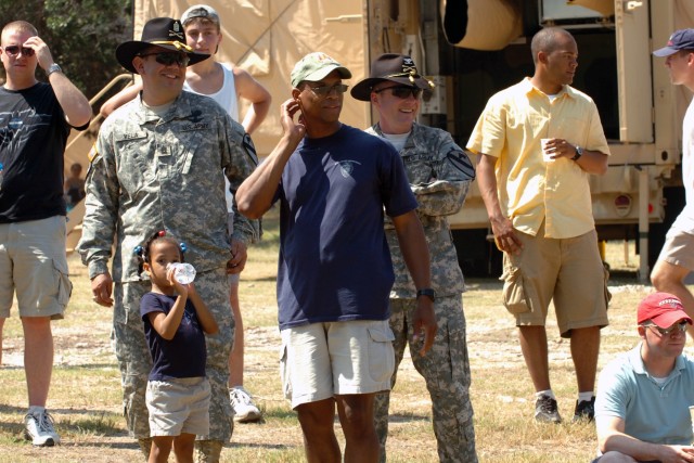 A very simple way to shield the summer sun is to use Stetsons or baseball caps. Colonel Douglas Gabram (right in Stetson), commander of the 1st Air Cavalry Brigade, 1st Cavalry Division, Lt. Col. Charles Dalcourt (center in ball cap), commander of...