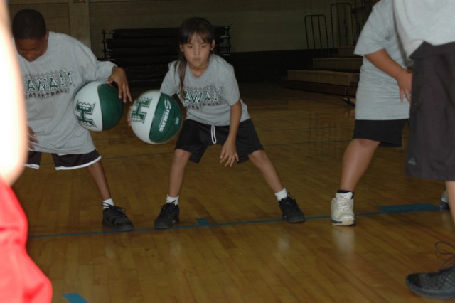 Rainbow jumpers: Youth hone basketball skills at UH-sponsored clinic