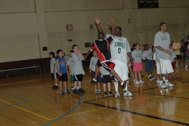 Rainbow jumpers: Youth hone basketball skills at UH-sponsored clinic