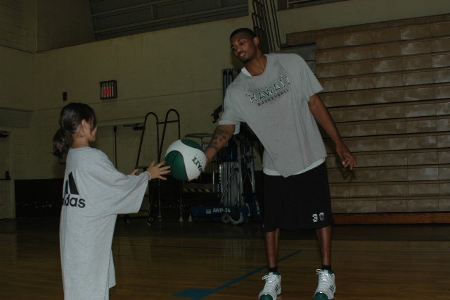 Rainbow jumpers: Youth hone basketball skills at UH-sponsored clinic