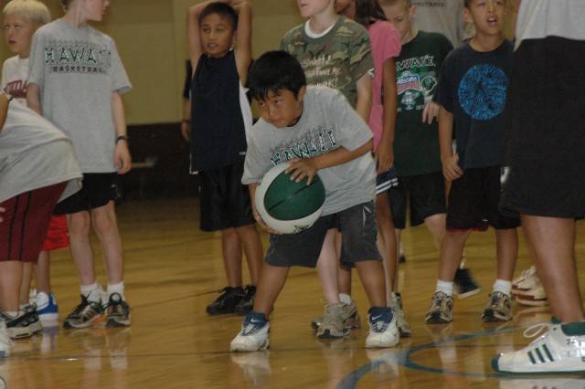 Rainbow jumpers: Youth hone basketball skills at UH-sponsored clinic