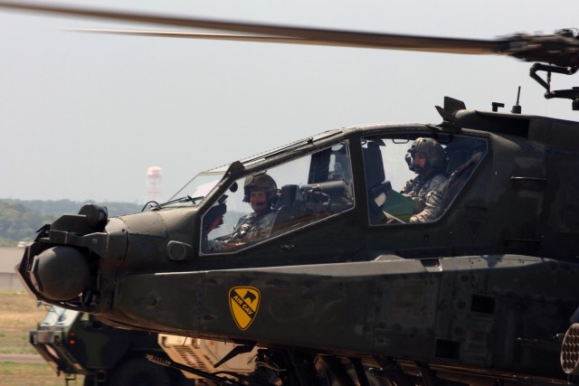 Chief Warrant Officer 4 James "Jimbo" Snyder (back seat), an AH-64D Apache attack helicopter pilot for 1st "Attack" Battalion, 227th Aviation Regiment, 1st Air Cavalry Brigade, 1st Cavalry Division, taxis his aircraft back to his parking spot...