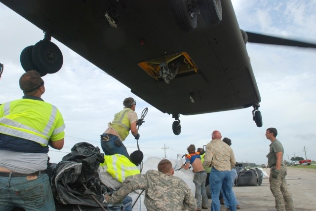 National Guard teams with local citizens to stem breached levee