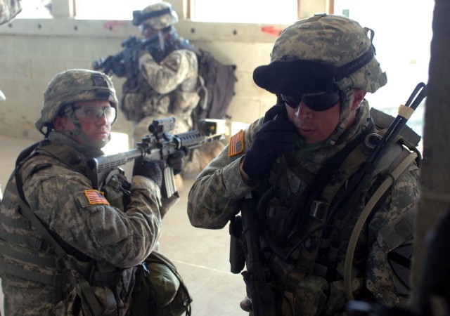 Soldiers from Company D "Diablo," 2nd Battalion, 5th Cavalry Regiment, 1st Brigade Combat Team, 1st Cavalry Division, clear and secure the house of a possible insurgent during Military Operations on Urban Terrain training Sept. 6. "Diablo" took part ...