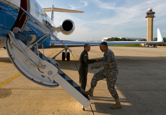 Chief of Staff of the Army Gen. George W. Casey, Jr., shakes hands with an aircrew member