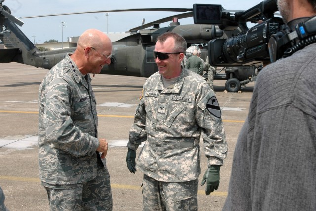 General Victor Renuart Jr. (left), the commanding general of U.S. Northern Command, talks with Col. Douglas Gabram (right), the commander of 1st Air Cavalry Brigade, 1st Cavalry Division, before flying on a mission out of Ellington Field, Houston,...