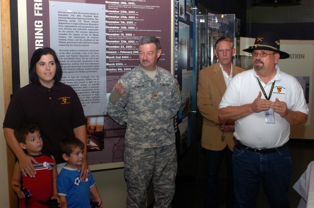 Following a cake cutting ceremony, Steven Draper (far right), director of the 1st Cavalry Division Museum, speaks to a crowd gathered in celebration of the 1st Cav. Div.'s 87th birthday Sept. 13 at Fort Hood, Texas. Draper said a few words about...