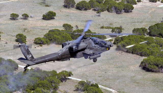 An AH-64D Apache attack helicopter pilots from 1st "Attack" Battalion, 227th Aviation Regiment, 1st Air Cavalry Brigade, 1st Cavalry Division, fire 2.75 inch rockets at a target during Iron Horse Rampage, a lane training exercise for 1st Brigade Comb...