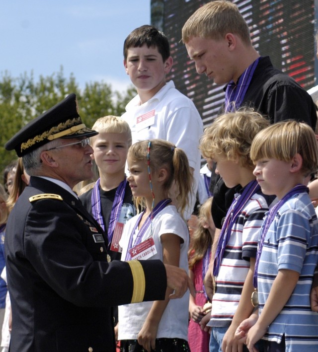 Gen. Casey greets children of fallen warriors