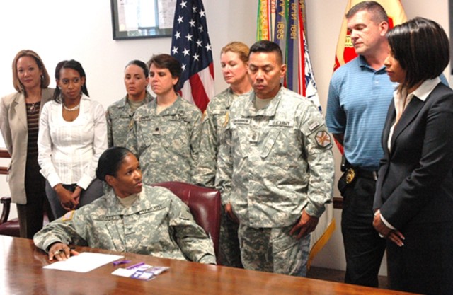 Garrison commander signs proclamation promoting domestic violence awareness