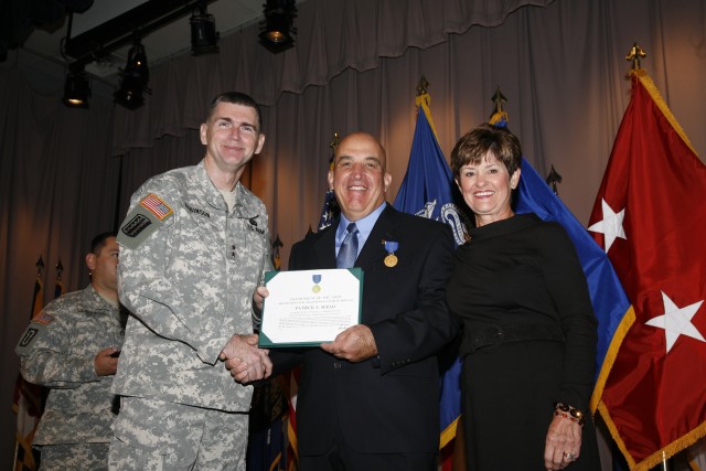 PICATINNY ARSENAL, N.J. -- Maj. Gen. Fred D. Robinson Jr., commanding general of the Research, Development and Engineering Command, recognizes Patrick A. Serao, executive director of the Engineering Center’s Enterprise and Systems Integration...