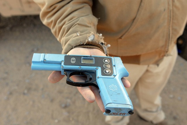 Victorville Calif. Native John R. Rhodes, an electronic technician, tests the operation of the Multiple Integrated Laser Engagement System (MILES) gear attached to all the vehicles within the National Training Center here at Fort Irwin, Calif....