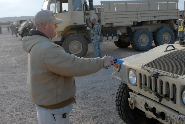 Victorville Calif. Native John R. Rhodes, an electronic technician, tests the operation of the Multiple Integrated Laser Engagement System (MILES) gear attached to all the vehicles within the National Training Center here at Fort Irwin, Calif....
