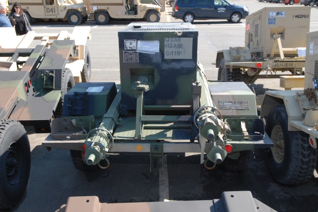 From left, Dina Flory, John Cramer and Walter Rosati catalog generators and sets of generators stored at Tobyhanna.  When Flory visits the depot, members of the Reset cell assist h