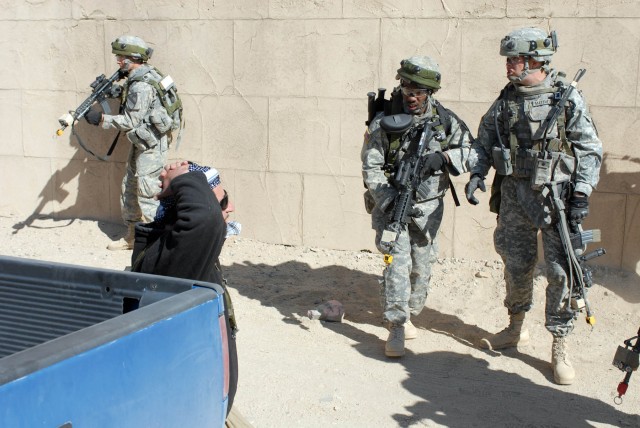 White Platoon Soldiers from 2nd "Lancers" Battalion 5th Cavalry Regiment, 1st Brigade Combat Team, 1st Cavalry Division, come face-to-face with the high valued "target" they were to bring in for questioning during a training exercise at Ft. Irwin,...