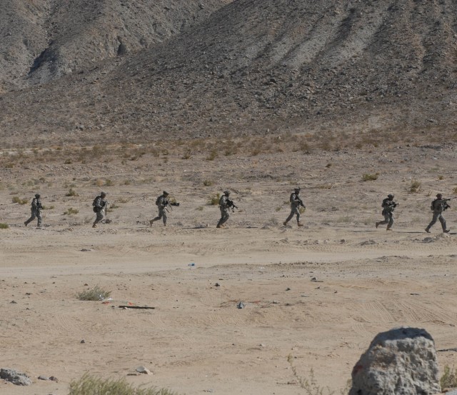 Soldiers from Delta Company 2nd “Lancers” Battalion, 5th Cavalry Regiment, 1st Brigade Combat Team, 1st Cavalry Division’s White Platoon move on the simulated Iraqi “city” of Medina Jabal for a cordon and search operation during an...