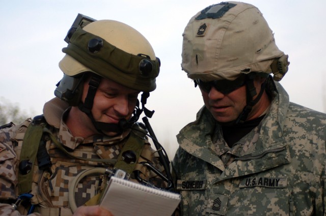 U.S. and Latvian Soldiers Compare Notes at Hohenfels