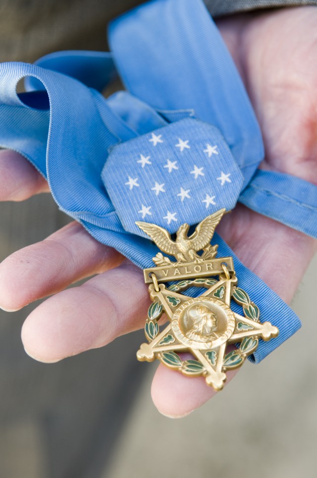 Holding the Medal of Honor