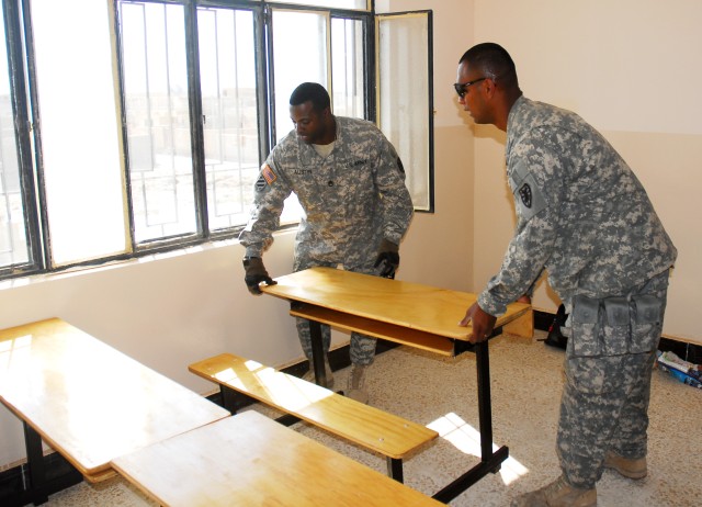 Sgt. 1st Class Derrick Austin, (left) support operations, 7th Sustainment Brigade, and Pfc. Vai Spalding, (right) chaplain&#039;s assistant,  7th Sustainment Brigade