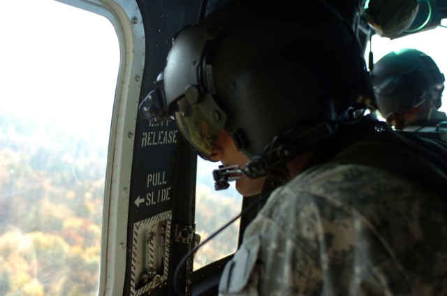 081018-A-6128E-002 Falcon Team member observes training from above