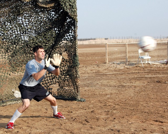 Capt. Shawn Robertson, assigned to the 27th BSB, attempts to block a soccer ball during a soccer match with MTR, 10th IA Div. Soldiers at COB Adder in southern Iraq Oct. 23. The contest was an effort to further strengthen the two units'...