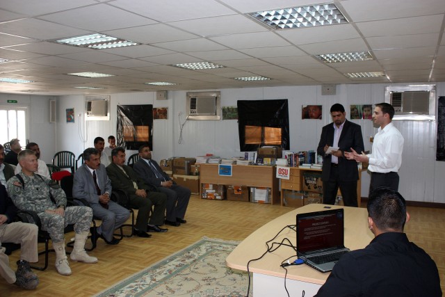 Josh Mater provides a briefing to the Dhi Qar University Chancellor Dr. Ali Ismael al Snafi and university officials Nov. 11 near Nasiriyah.  Mater worked through the Michael Scott Mater Foundation to establish a partnership between Oregon State...