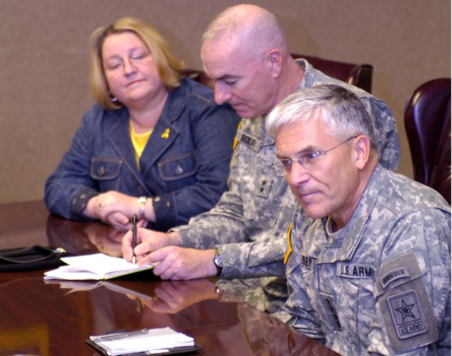 Chief of Staff of the Army Gen. George W. Casey Jr. (far right) seated next to 1st Cavalry Division Commander Maj. Gen. Daniel P. Bolger (center) made his second visit to the 1st Cav. Div. in four months to address family readiness concerns with...