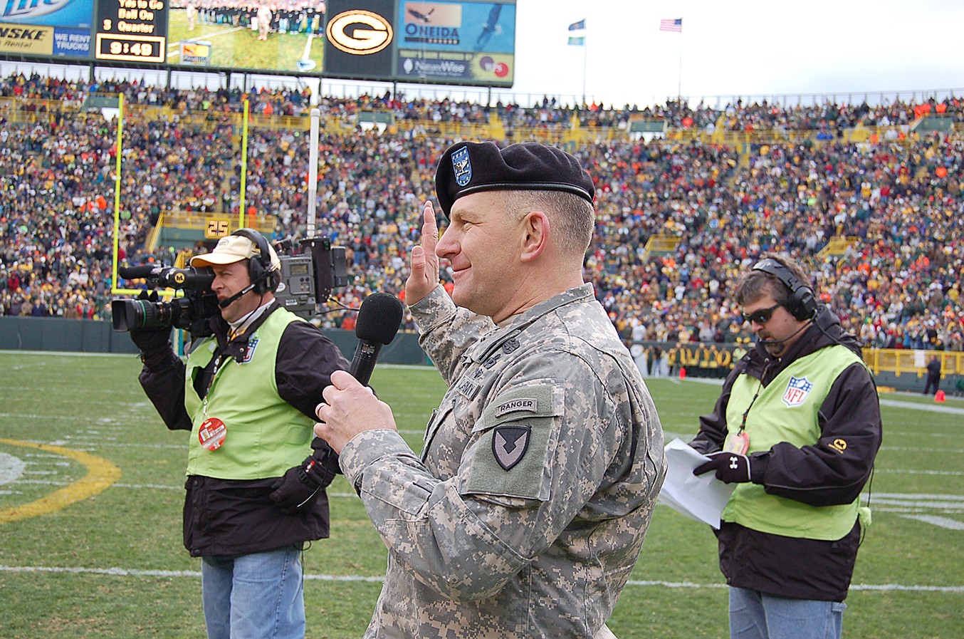 U.S. Military recruits are sworn in during halftime on Salute to