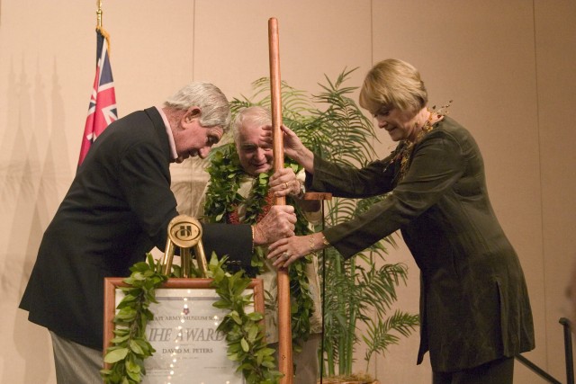Peters accepts award