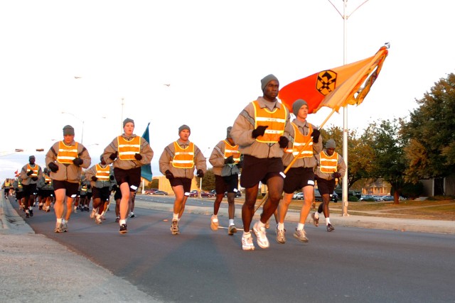 Command Sgt. Maj. Nathaniel Bartee Sr., the senior noncommissioned officer for the 15th Sustainment Brigade, 13th Sustainment Command (Expeditionary), leads the brigade's NCOs on a brisk four-mile run Nov. 21 to build esprit de corps and get their...