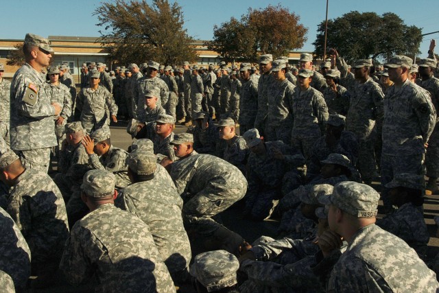 Lt. Col. Peter Haas, the commander of the 49th Transportation Battalion, 15th Sustainment Brigade, 13th Sustainment Command (Expeditionary), gives his Soldiers a quick safety briefing at the brigade's headquarters before turning them over to their cl...