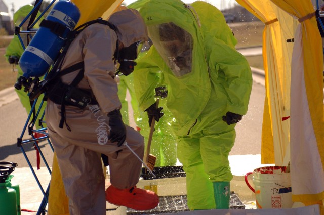 After completion of their simulated chemical collection Soldiers must carry out a rigorous and tedious decontamination process that includes the scrubbing of the entire Level A ,self containing breathing apparatus gear, and all equipment used at the ...