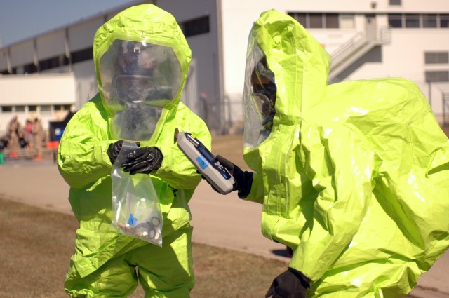 Soldiers participating in the toxic industrial chemical protection and detection equipment (TICPDE) training use a HazMat ID to identify chemical agents Nov. 18 at Fort Hood, Texas.  The handheld device uses a computerized sensor and diamond plate te...