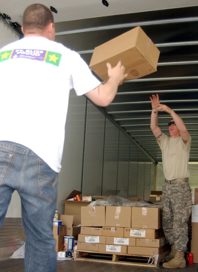 Soldiers unload donated goods for Fort Bliss families
