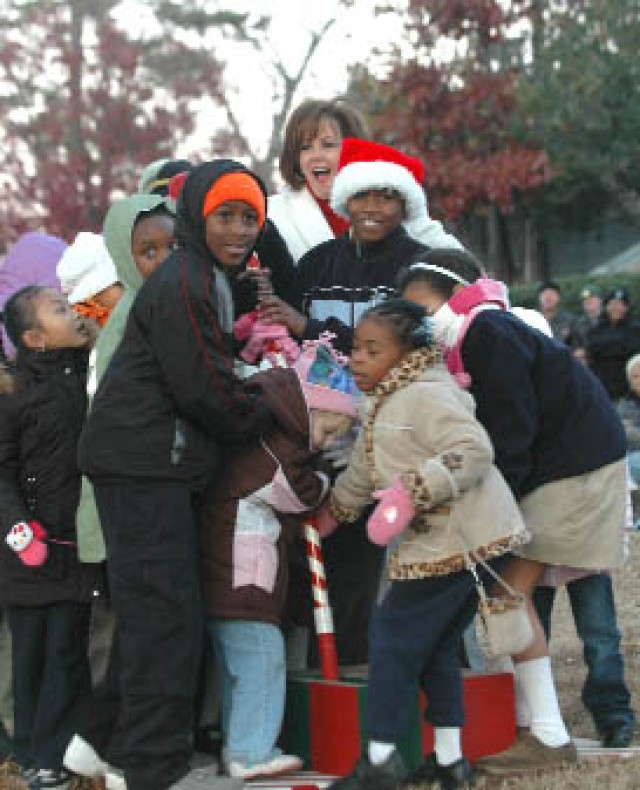 Community gathers to deck the halls, light installation Christmas tree