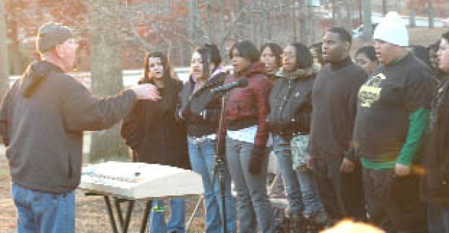 Community gathers to deck the halls, light installation Christmas tree