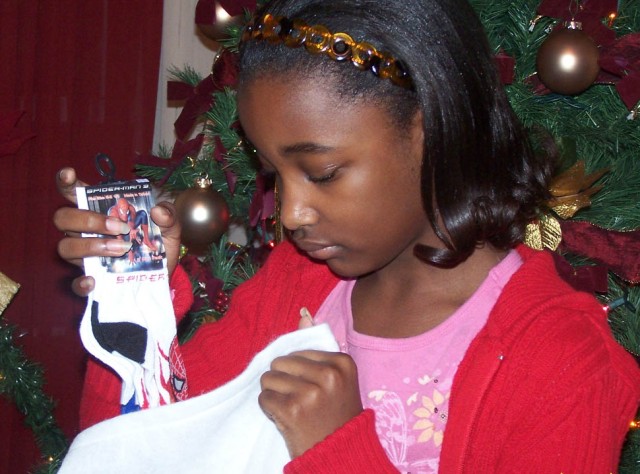 Military child learns lesson of gift giving: Local kids 'sock it to' children's hospitals