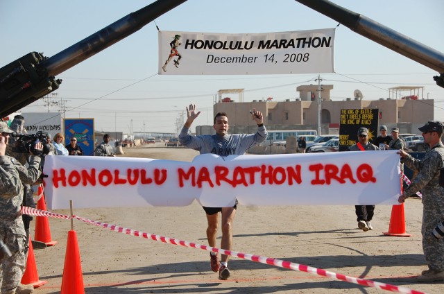 Runners participate in Honolulu Marathon at Camp Taji