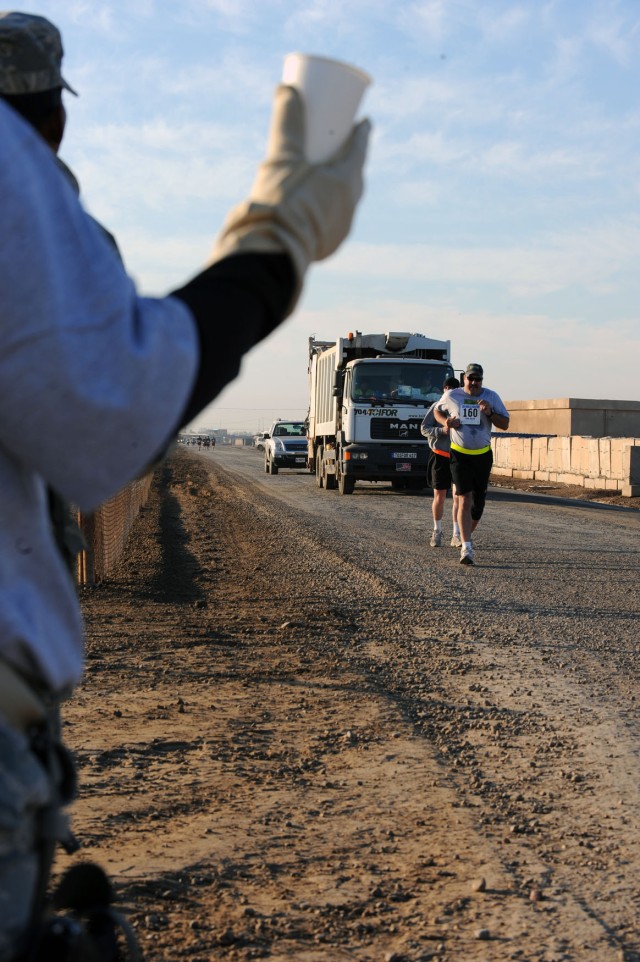 Runners participate in Honolulu Marathon at Camp Taji