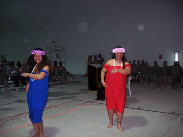 (Left) Spc. Sifusi Kuresa, assigned to the 142nd Combat Service Support Battalion, 7th Sustainment Brigade, along with Staff Sgt. Tinei Nanai, assigned to the 27th Brigade Support Battalion, 4th Brigade Combat Team, 1st Cavalry Division performs a...
