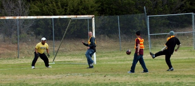 Soldiers from 3rd Battalion, 82nd Field Artillery, 2nd Brigade Combat Team, 1st Cavalry Division take part in an organized sports day on Dec. 13. The intent of the sports day was to give Soldiers a time to relax after a stressful week. The Soldiers w...