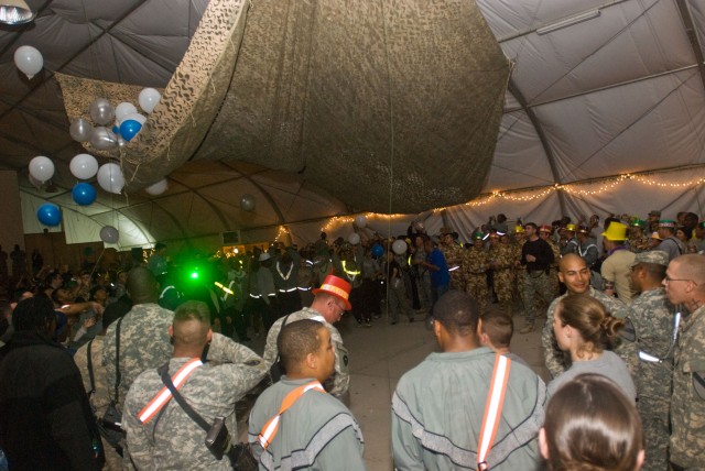 Soldiers assigned to the Long Knife Brigade and other supporting units at Contingency Operating Base Adder ring in 2009 with a balloon drop at the stroke of midnight. The New Year marked the passage of time for some Soldiers while it served as a...