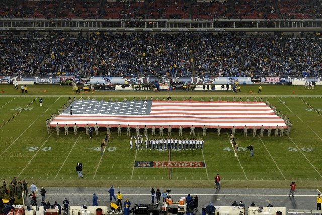 Soldiers unfurl flag at NFL Game
