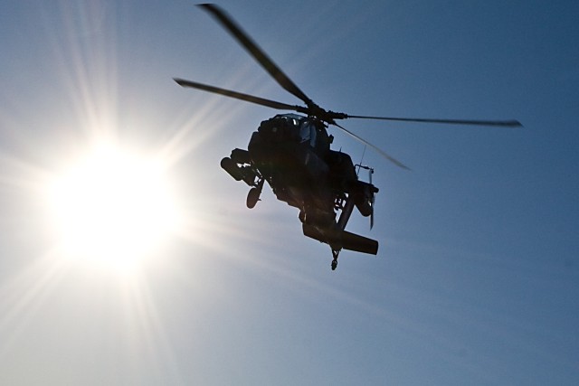 An  AH-64D Apache attack helicopter from 1st Attack Reconnaissance Battalion, 227th Aviation Regiment, as it soars overhead upon departure from Robert Gray Army Airfield, Fort Hood, Texas, Jan. 8. The aircraft is leaving for Fort Irwin, Calif. to con...