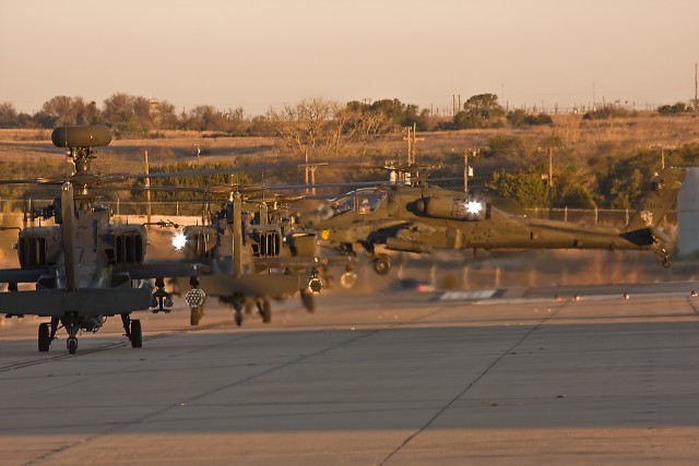 Four AH-64D Apache attack helicopters from 1st Attack Reconnaissance Battalion, 227th Aviation Regiment, 1st Air Cavalry Brigade, 1st Cavalry Division, stand by to launch from Robert Gray Army Airfield, Fort Hood, Texas, Jan 8. The aircraft will be f...