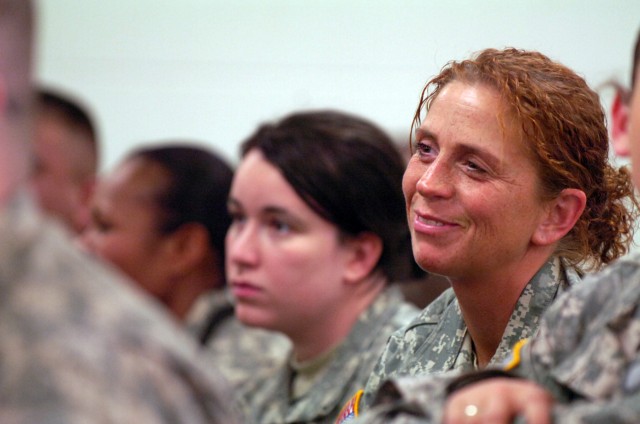 Linesville, Pa. native, Staff Sgt. Lori Ann Whiteman (right) an intelligence team leader with Company A,  2nd Special Troops Battalion, 2nd Brigade Combat Team, 1st Cavalry Division, dons a light-hearted smile during the initial flight briefings...