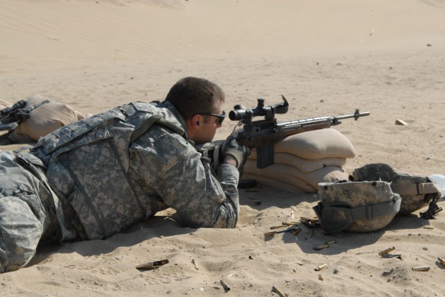 Chicago native Spc. Stephen Battisto, a cavalry scout and squad designated marksman with Troop C, 4th Squadron, 9th Cavalry Regiment, 2nd Brigade Combat Team, 1st Cavalry Division, steadies his aim while zeroing his M-14 rifle at a rifle range near C...